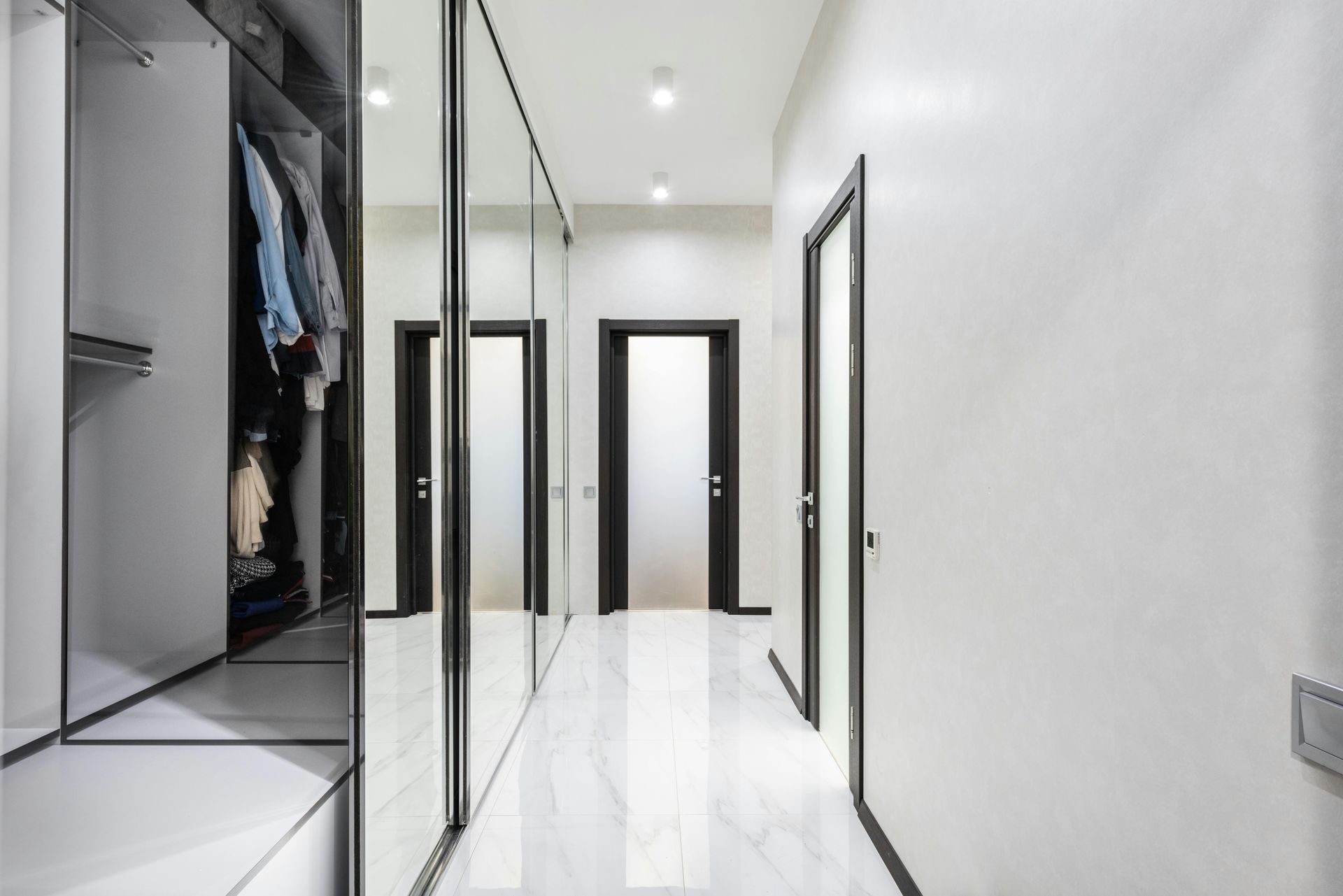 Glass Wardrobe along left side of corridor with white tiles — Canobolas Glass Service In Orange, NSW