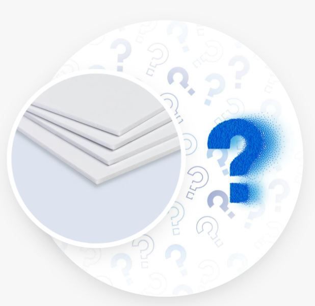 A stack of white sheets with a blue question mark in the middle