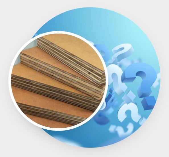 A close up of a piece of plywood with a question mark in the background