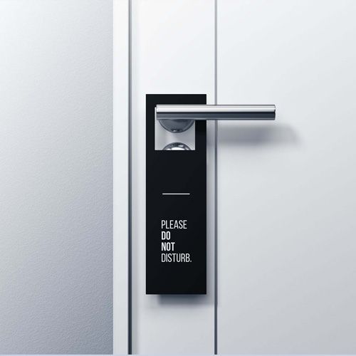 A door with a sign on it that says please do not disturb.