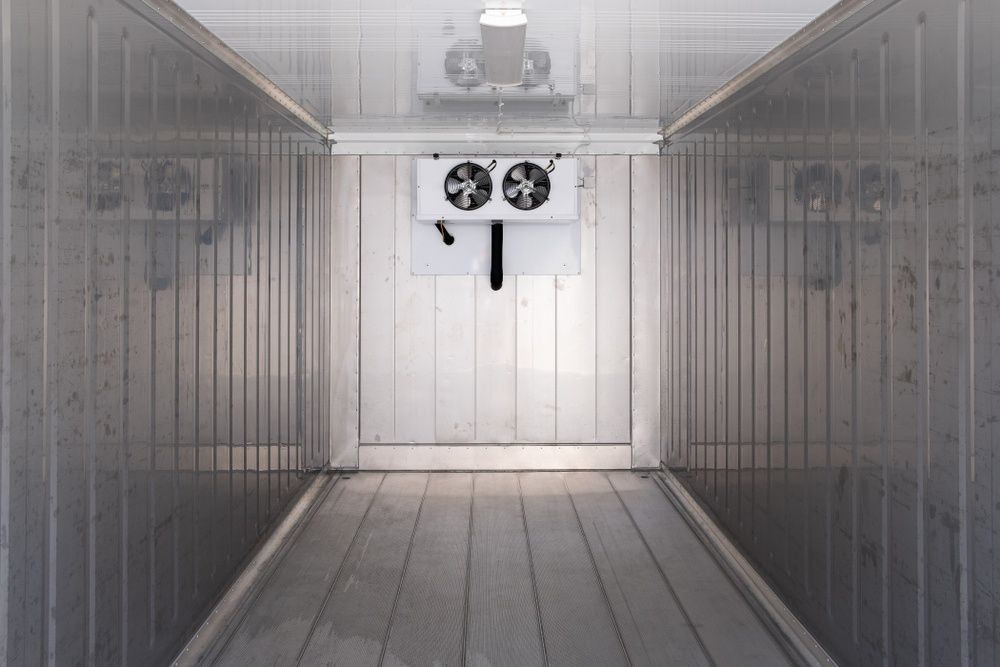 Inside an Empty Refrigerated Storage Container, Silver Walls, and Floor — MAE Refrigeration In Gordonvale, QLD