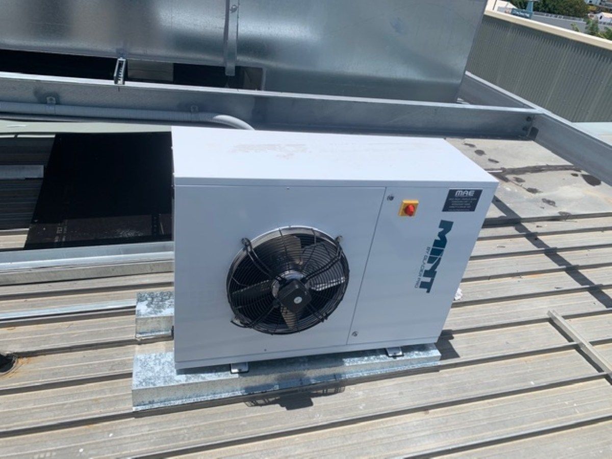 Hvac Unit on A Rooftop. Gray Metal Box with Fan — MAE Refrigeration In Innisfail, QLD