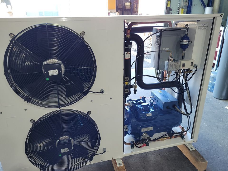 White Refrigeration Unit with Two Black Fans and Exposed Blue Compressor — MAE Refrigeration In Palm Cove, QLD