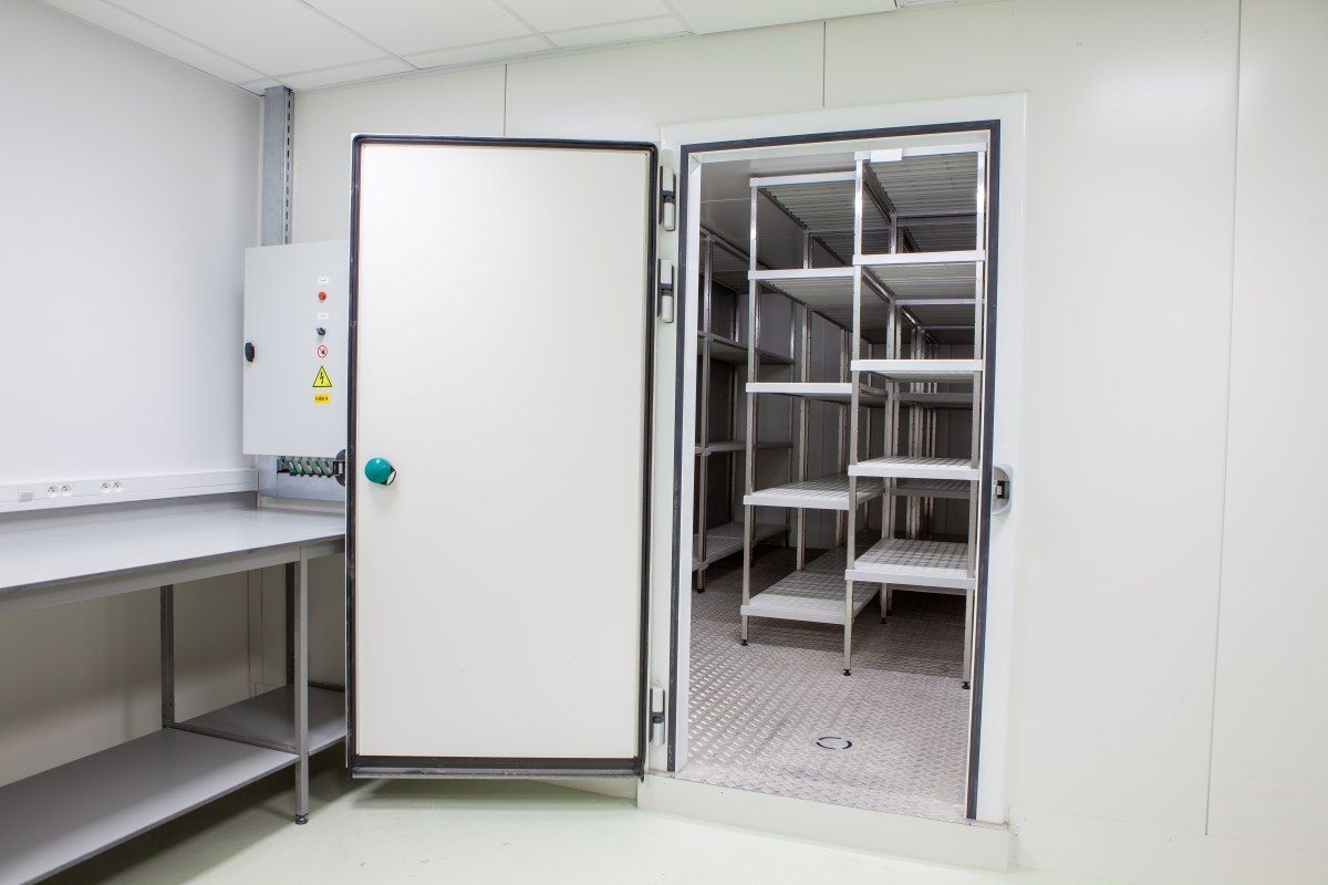 Open White Walk-In Freezer with Stainless Steel Shelves — MAE Refrigeration In Portsmith, QLD