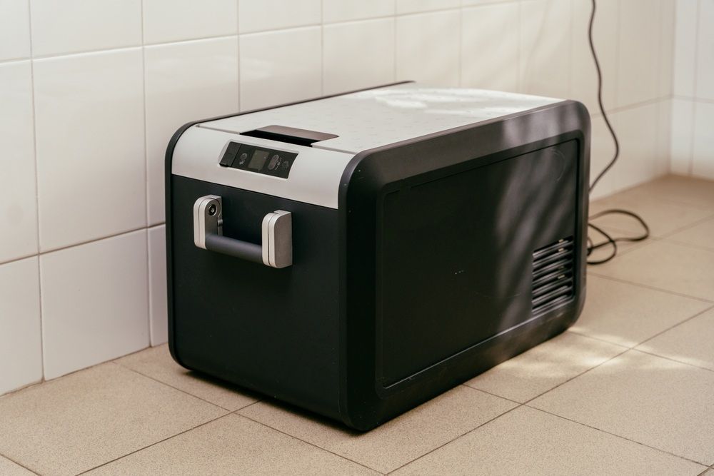 Portable Black and Gray Fridge-Freezer with A Handle — MAE Refrigeration In Smithfield, QLD