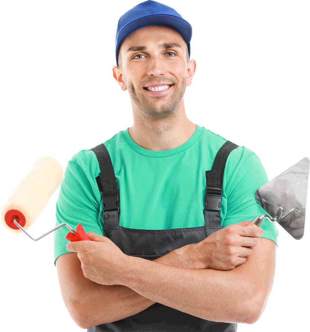 smiling male painter wearing green shirt and blue cap holding painting tools