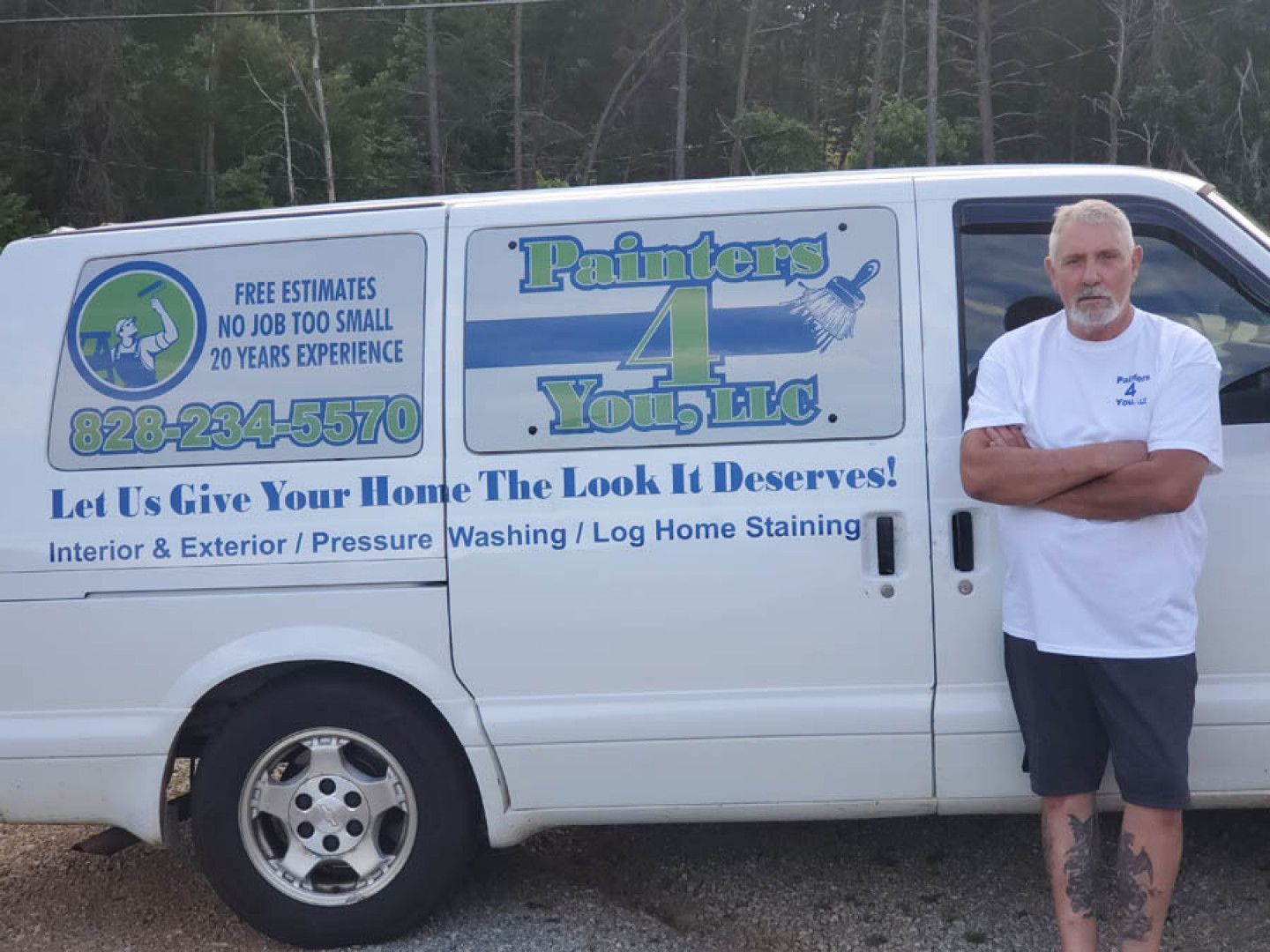 Bobby Moxley, owner standing beside company van