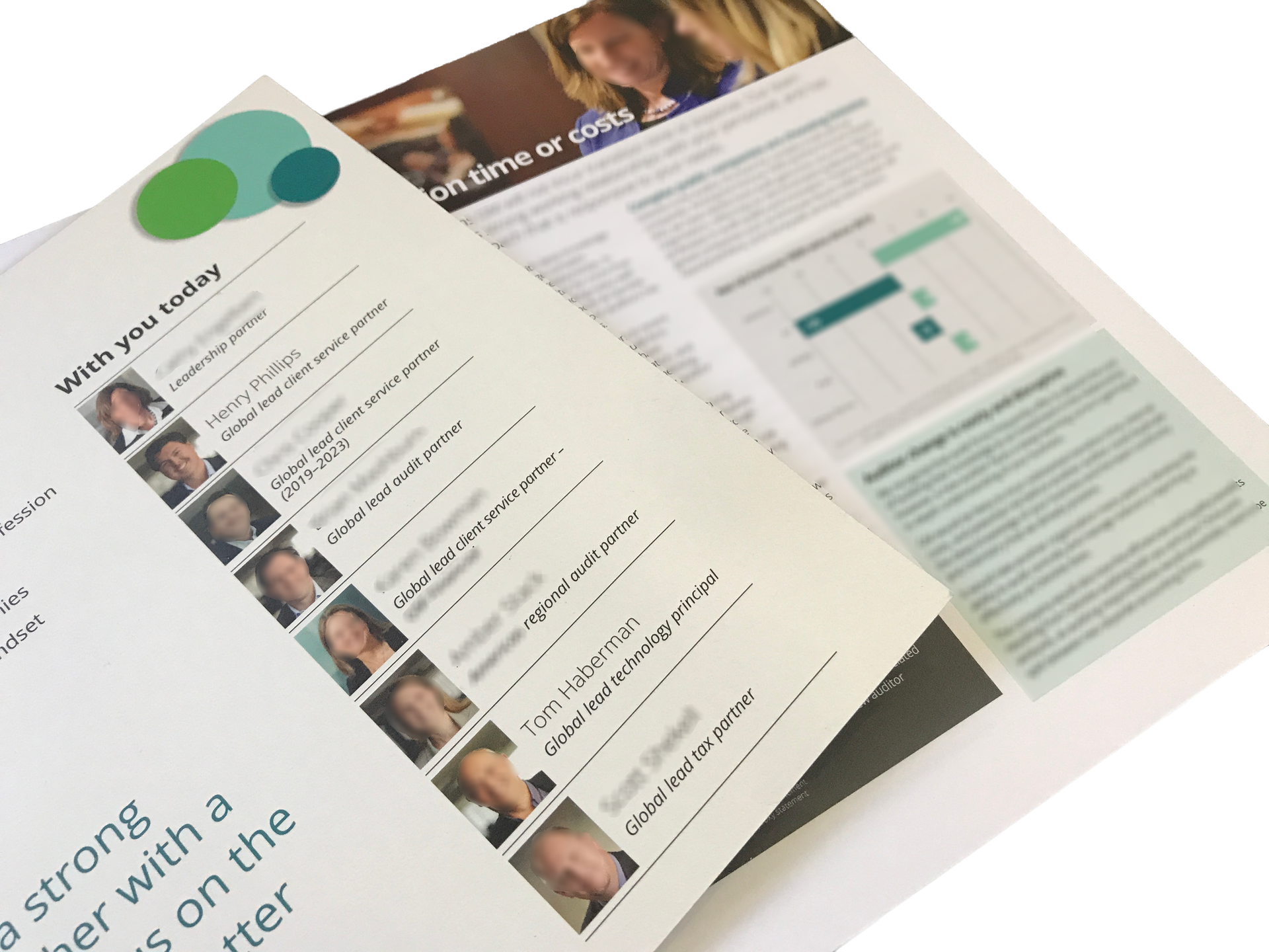 A close-up of two stacked brochures featuring headshots of team members, text, and a circular green logo design element.