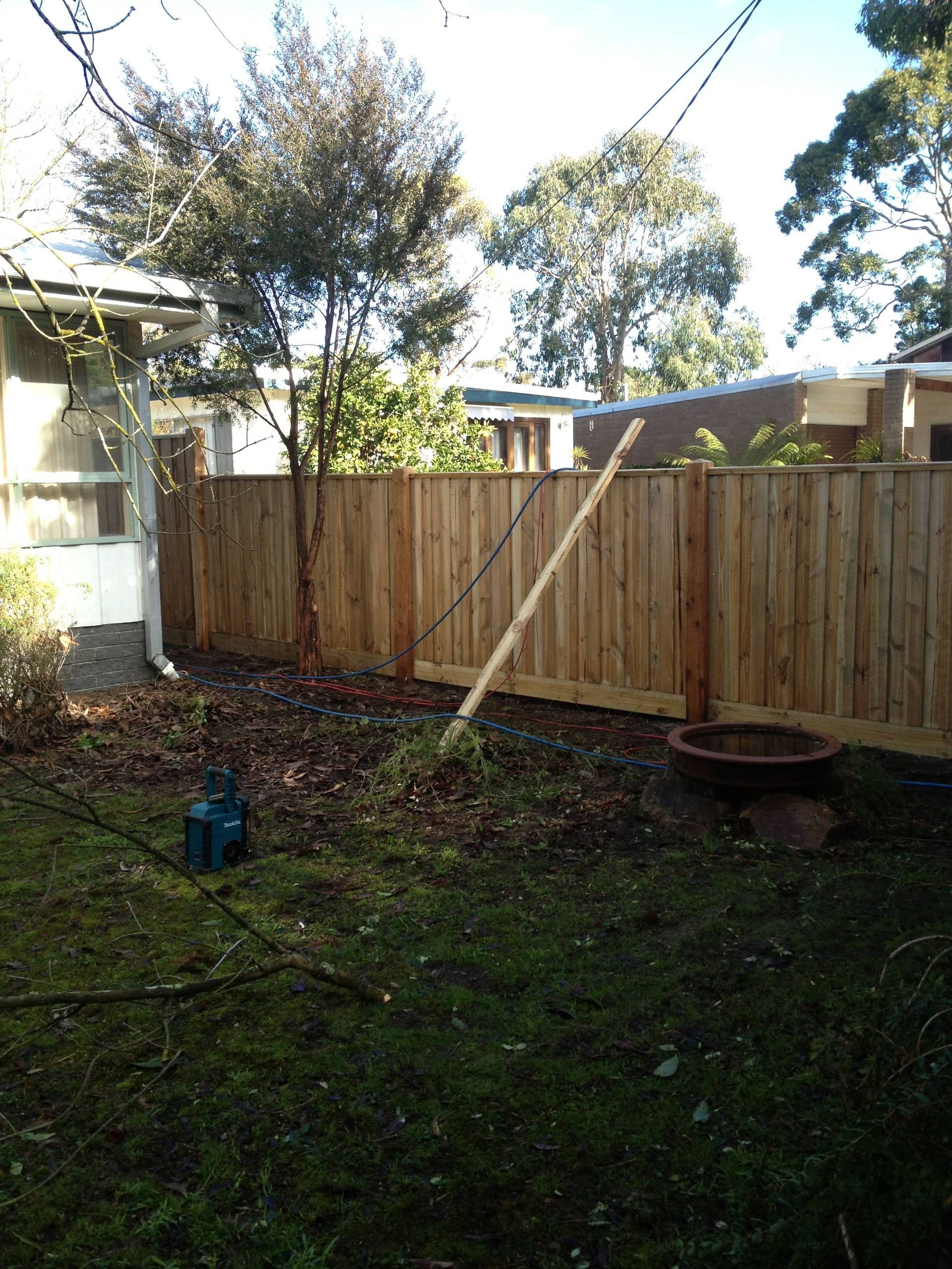 A wooden fence is in the backyard of a house — Aztech Fencing In Upsalls Creek, NSW