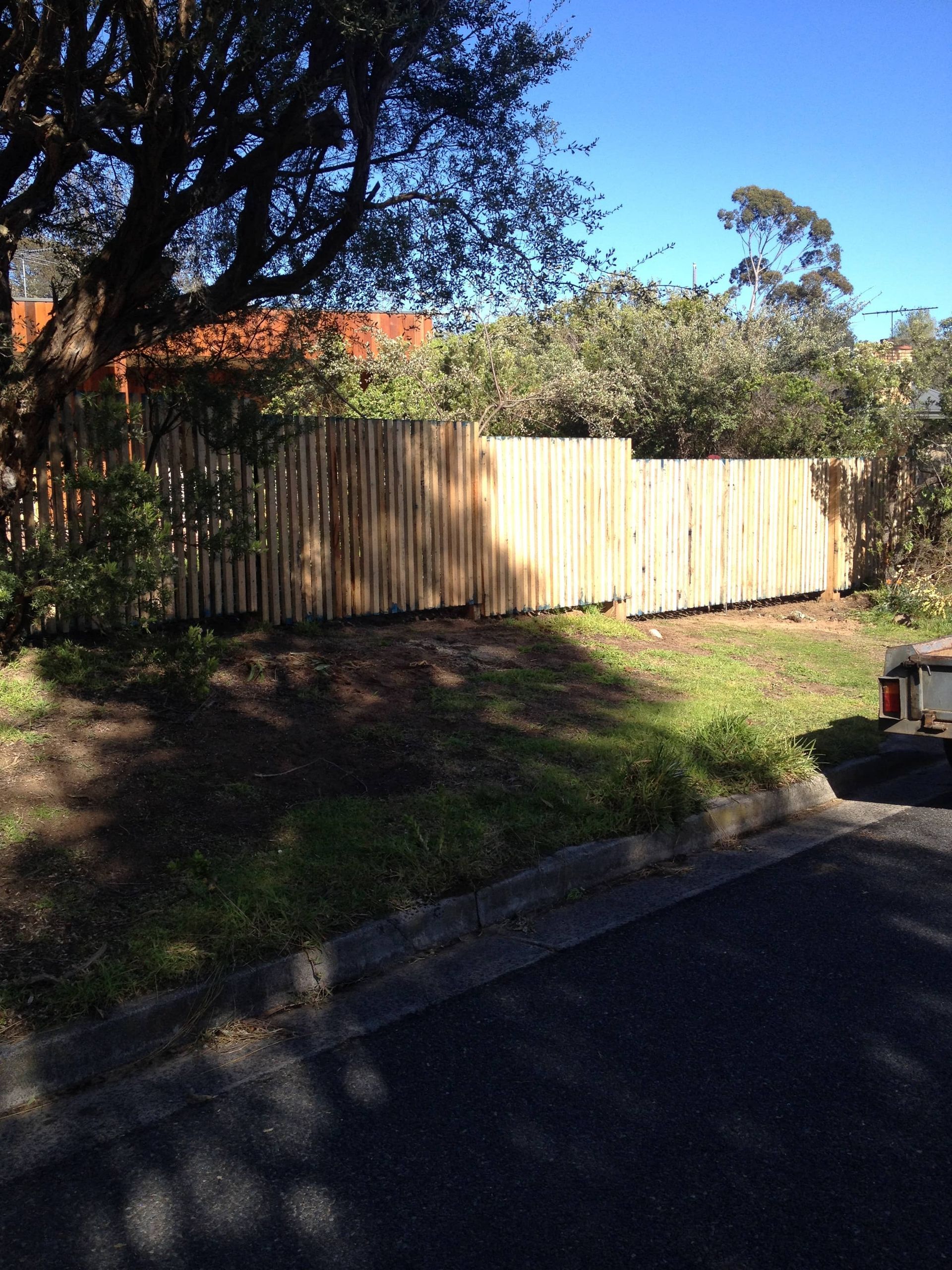 A wooden fence is in the middle of a yard — Aztech Fencing In Upsalls Creek, NSW