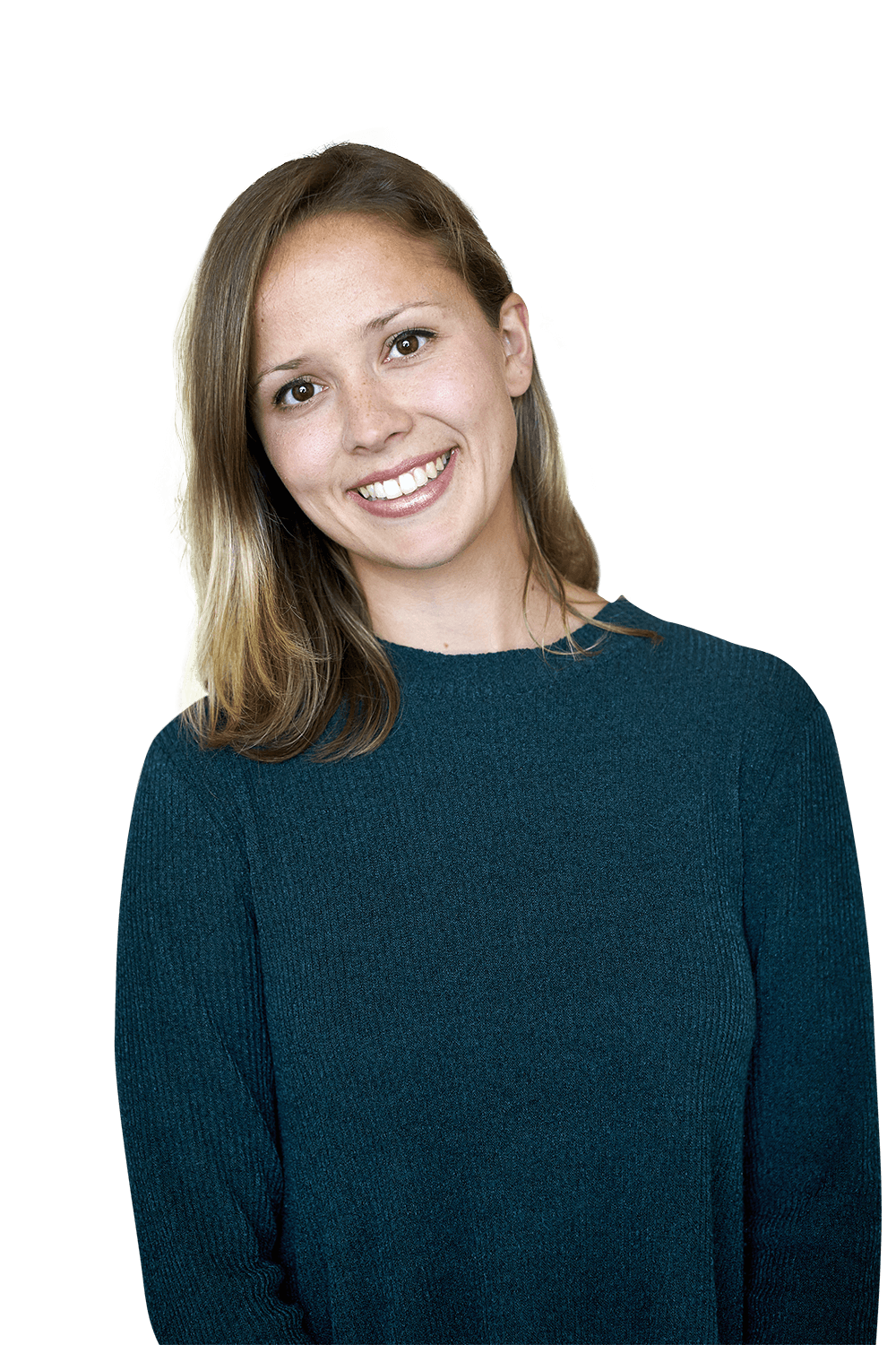 A woman in a blue sweater is smiling and looking at the camera.