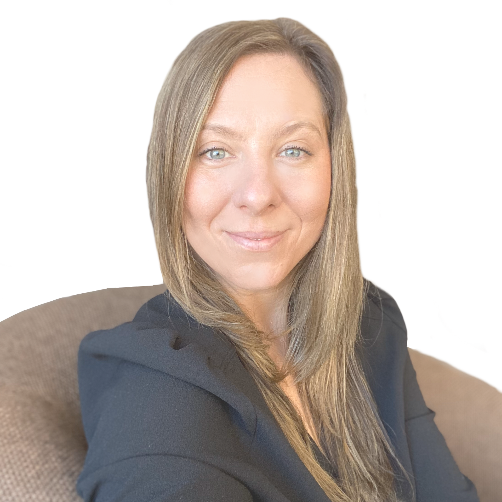 A woman is sitting in a chair and smiling for the camera.