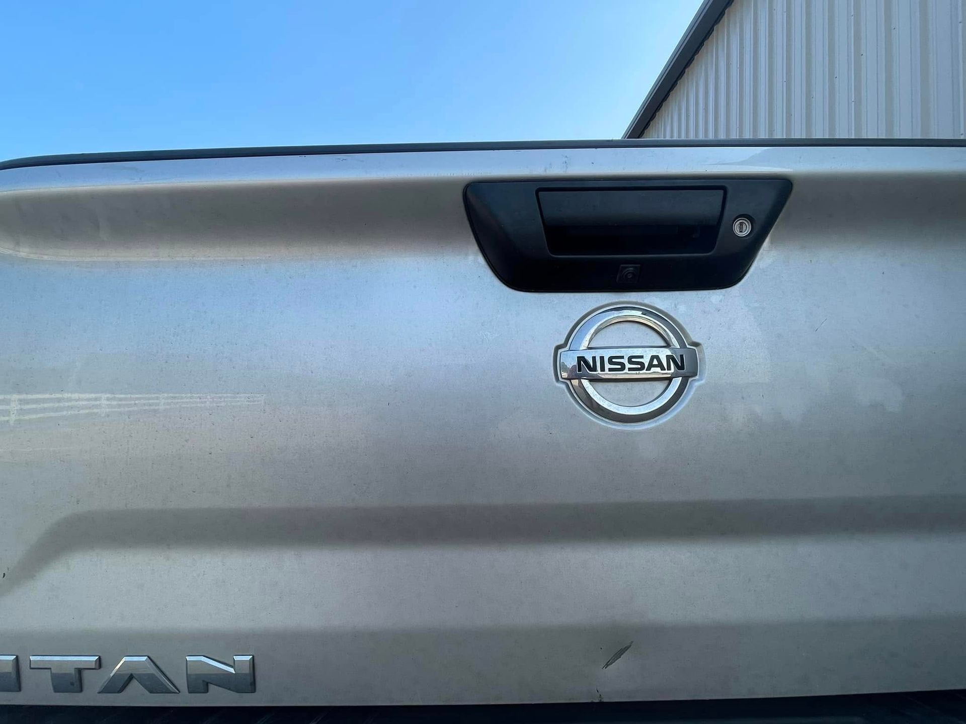 A close up of the back of a nissan titan truck