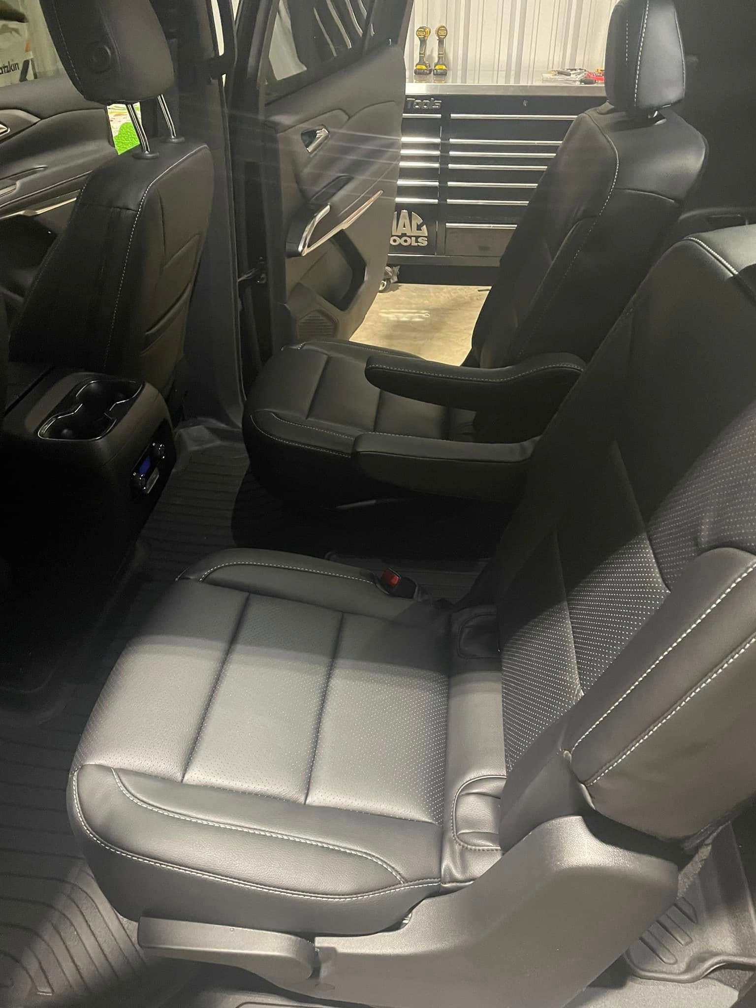 The back seats of a car are very comfortable and spacious.