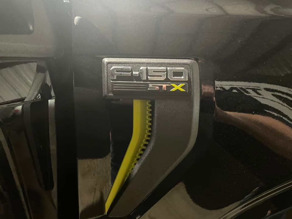 A close up of a ford f-150 gtx emblem