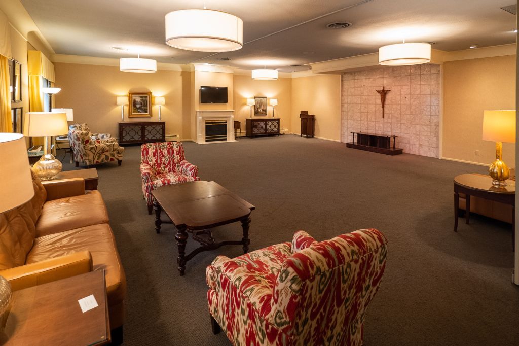 a living room filled with furniture and a fireplace .