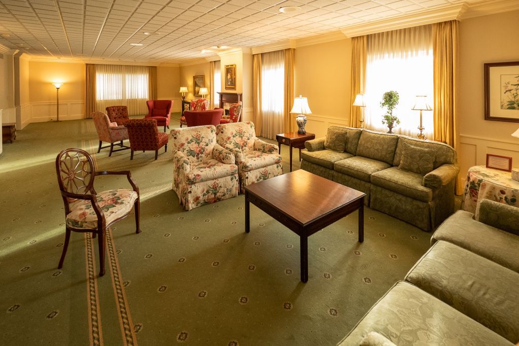 a living room filled with furniture and a coffee table