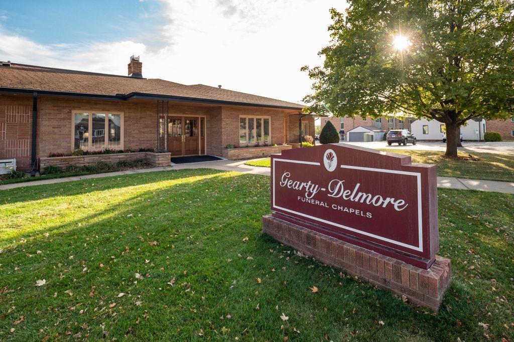 a building with a sign in front of it that says gravity delmore