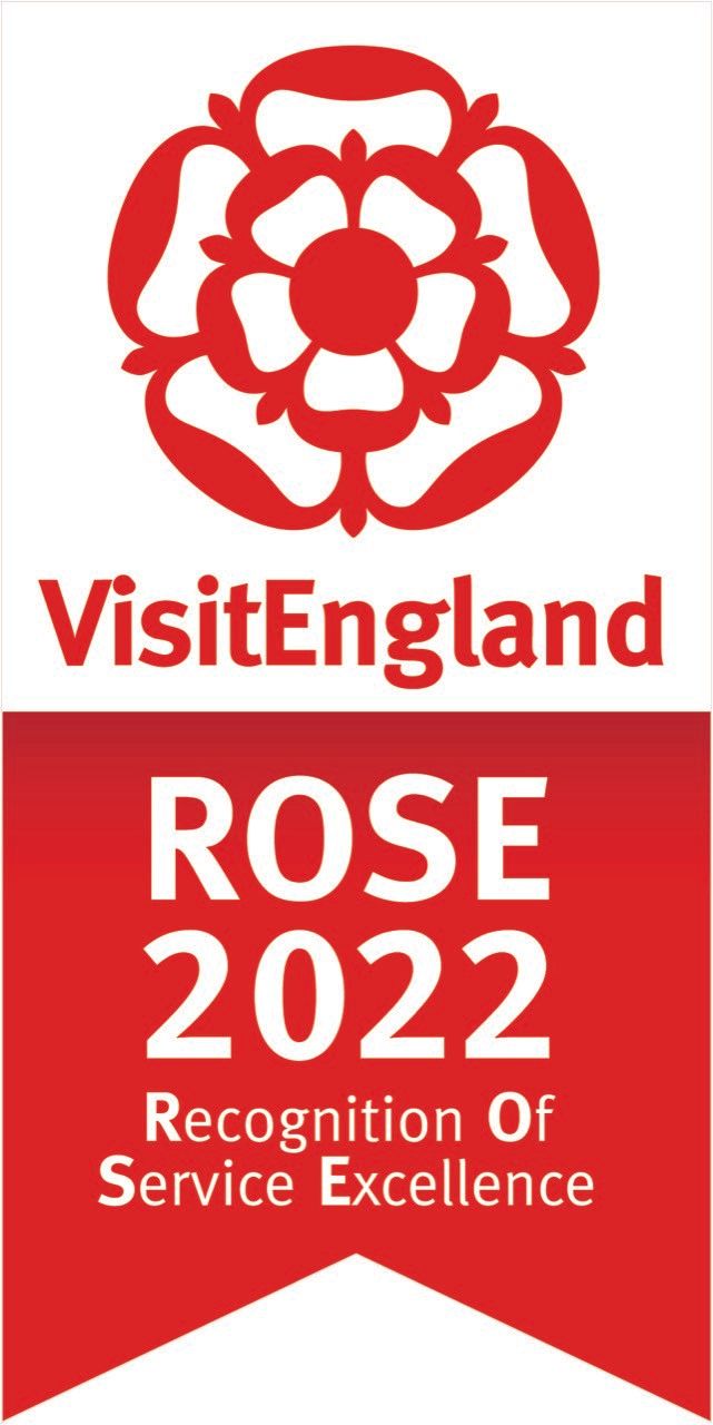 VisitEngland ROSE 2022 award logo featuring a red Tudor rose, and a red banner with white text indicating recognition of service excellence.
