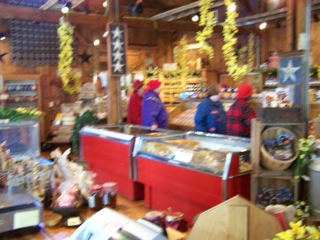 A blurred image of a store with a sign that says ' a ' on it