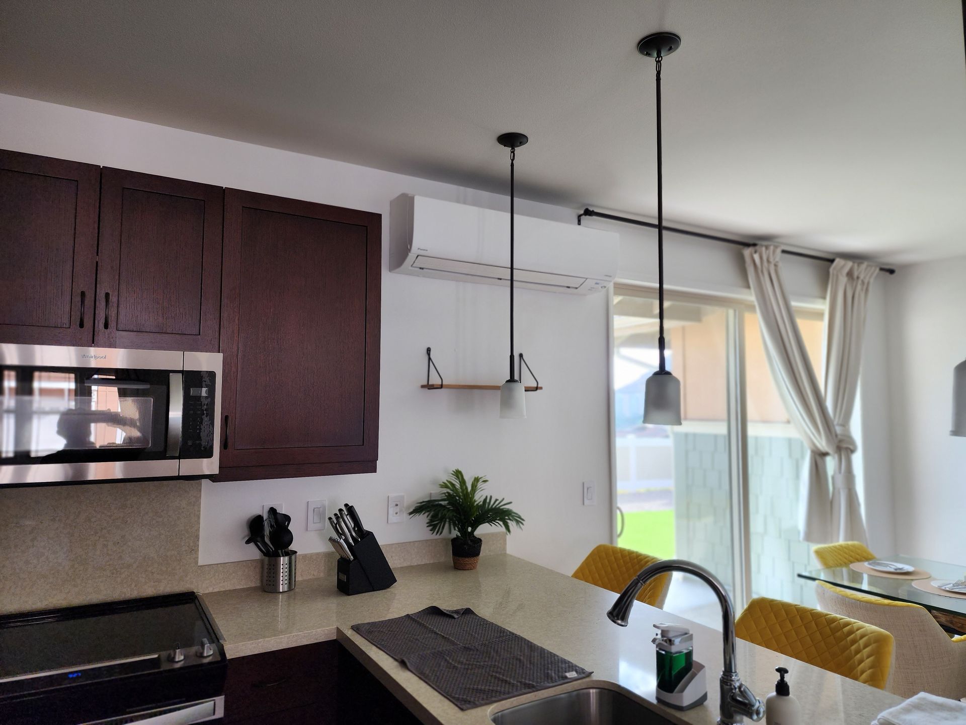 A kitchen with stainless steel appliances and a sink.