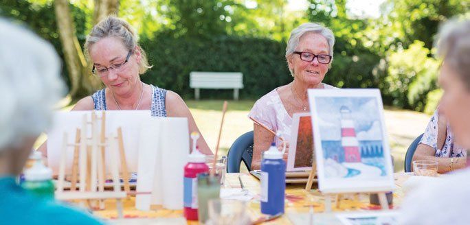 Two women taking an art class