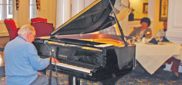 Elderly man playing piano