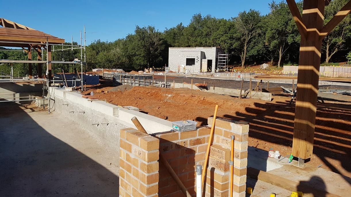 A Construction Site With Bricks and Tools in the Foreground  — Wayne Hall Concreting in South Lismore, NSW