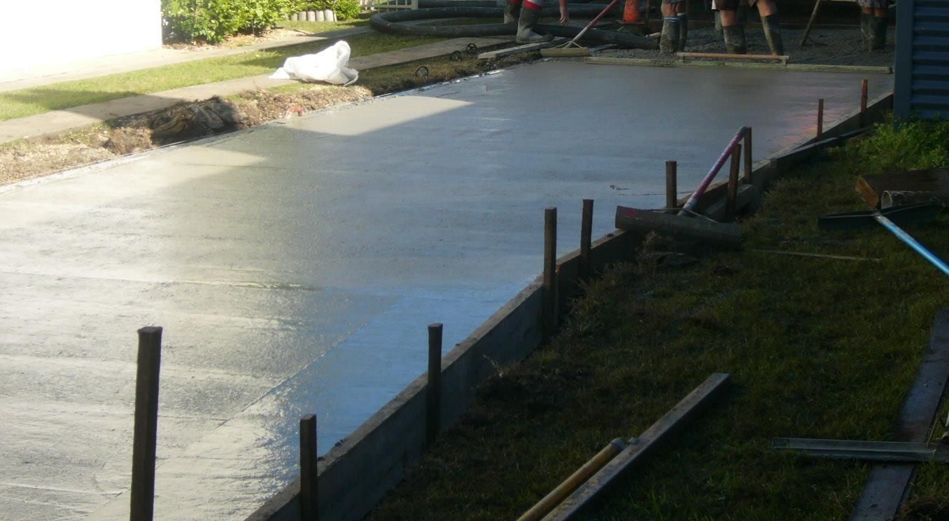 A Concrete Floor With a Wooden Frame Around It — Wayne Hall Concreting in Casino, NSW