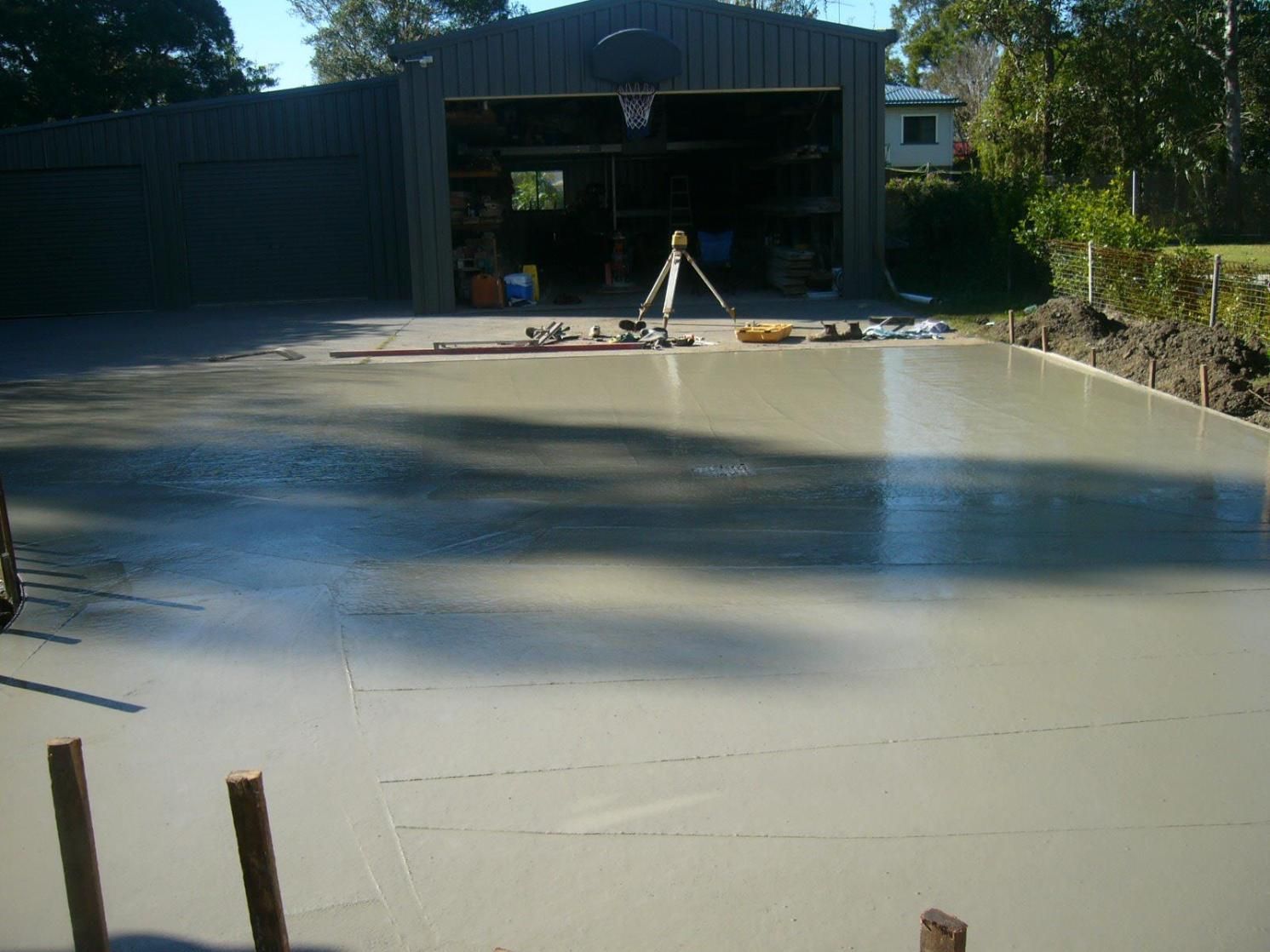 A Concrete Driveway With a Basketball Hoop in the Background — Wayne Hall Concreting in South Lismore, NSW
