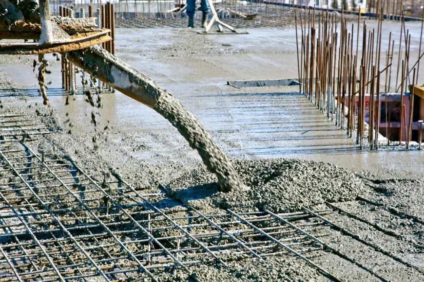 A Concrete Pump is Pouring Concrete on a Construction Site — Wayne Hall Concreting in South Lismore, NSW