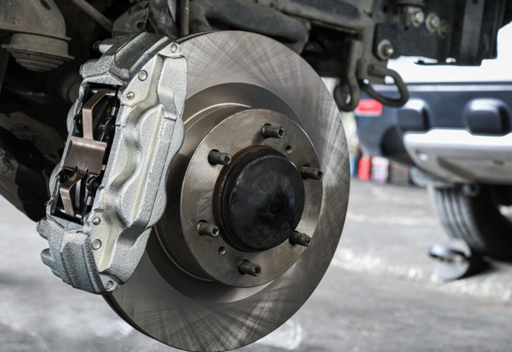 A Close Up Of A Brake Disc On A Car — Coffs Harbour Automotive In Coffs Harbour, NSW