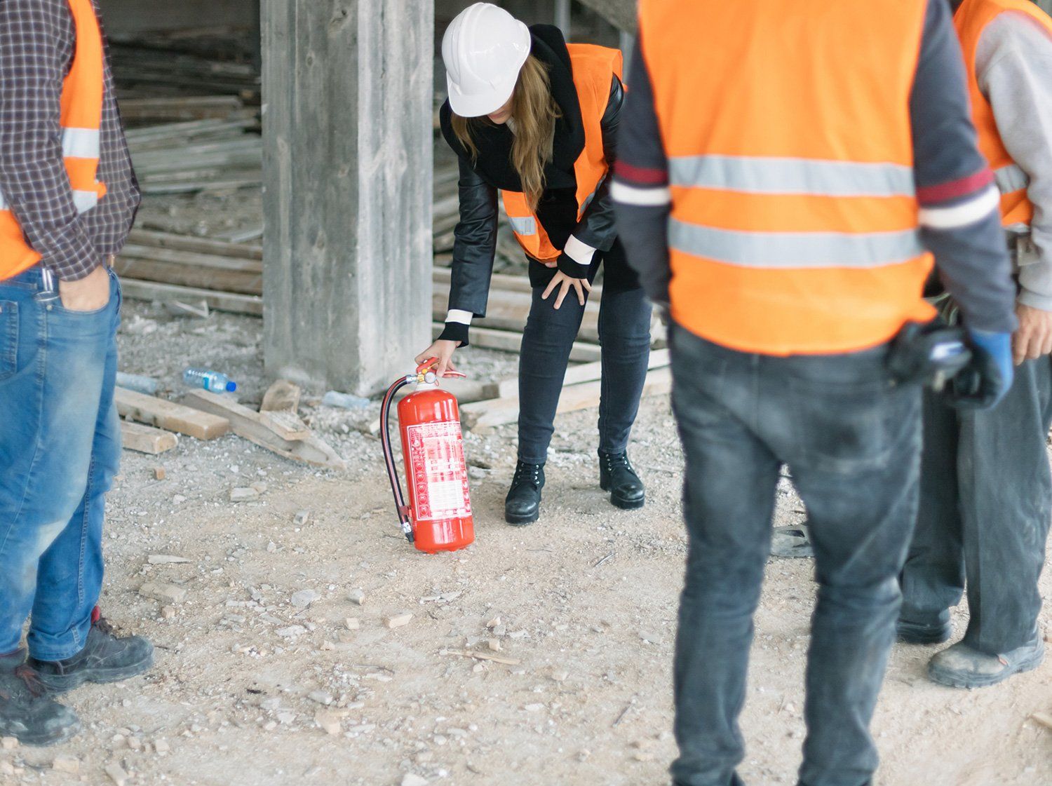 Woman Holding Fire Extinguisher — Staten Island, NY — Safety Environmental Inc.