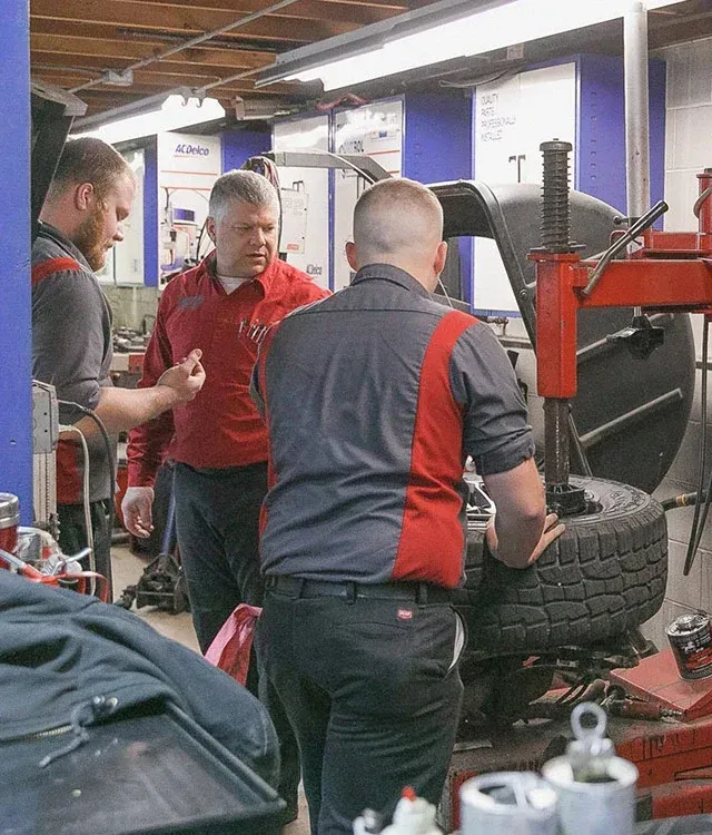 Mechanics work on Wheel Alignment Service | Jamestown Automotive, Inc.