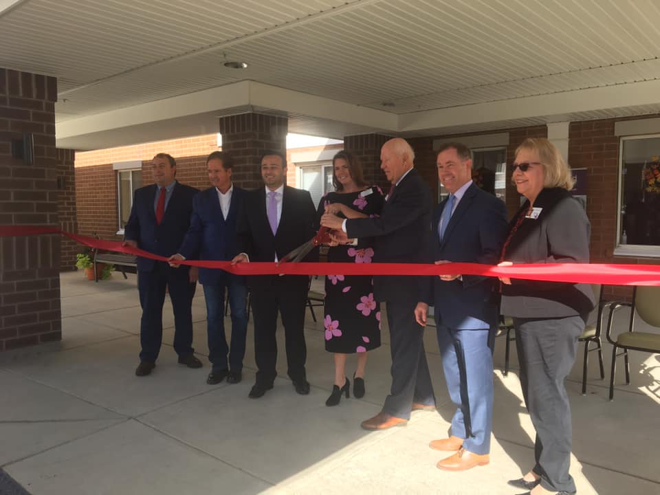 Local dignitaries and company official cut the ribbon at Heathwood Assisted Living & Memory Care in Williamsville, NY