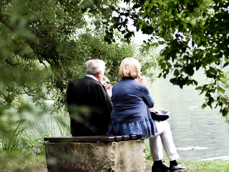 elderly couple sitting next to each other