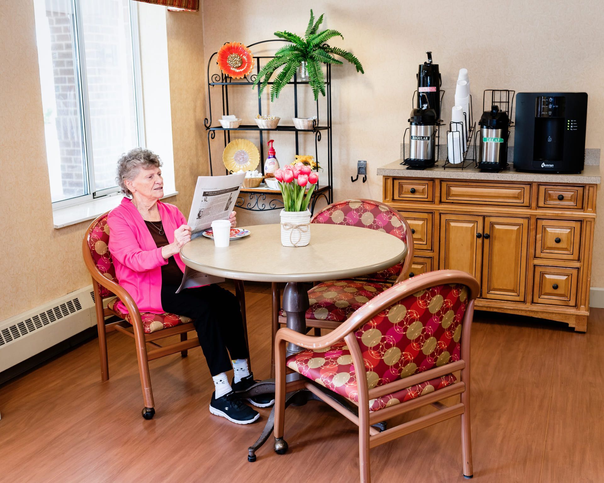 senior aged woman laughing with another woman