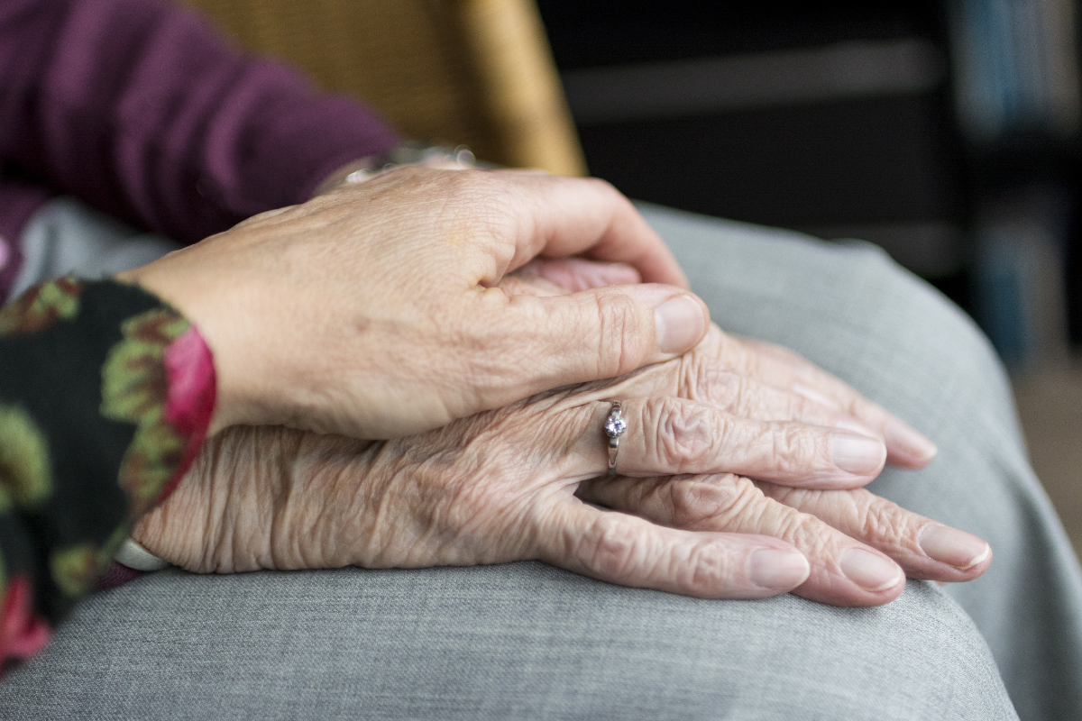 elderly couple sitting next to each other