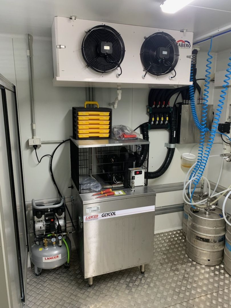 Interior of a refrigerated truck with kegs, tap system, and an ice machine.— Elements Air & Refrigeration In Westcourt, QLD