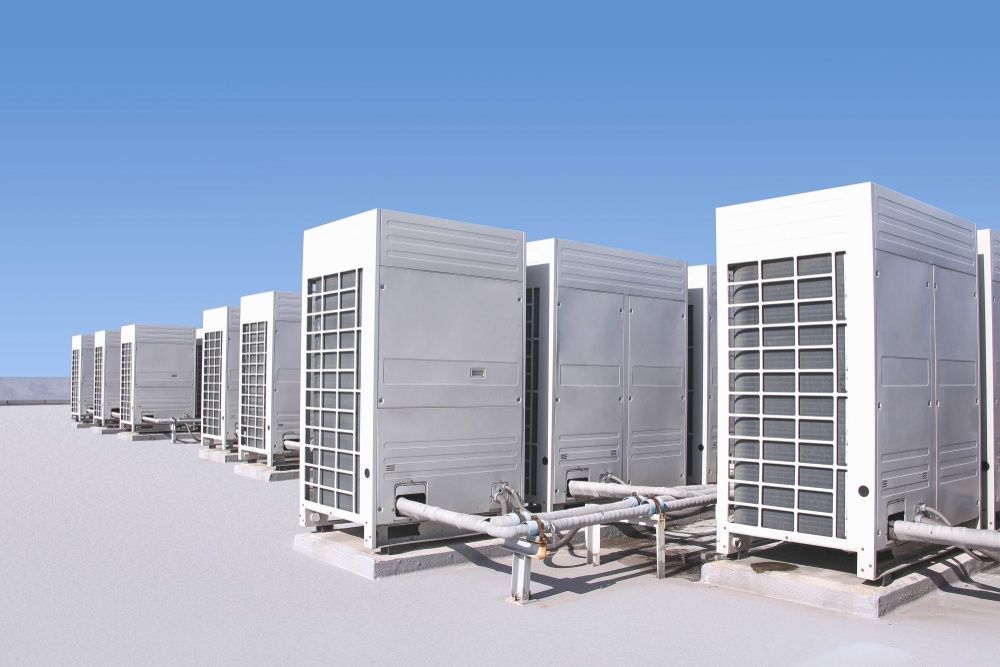 A Row of Air Conditioners Sitting on Top of a Building — Elements Air & Refrigeration In Northern Beaches, NSW