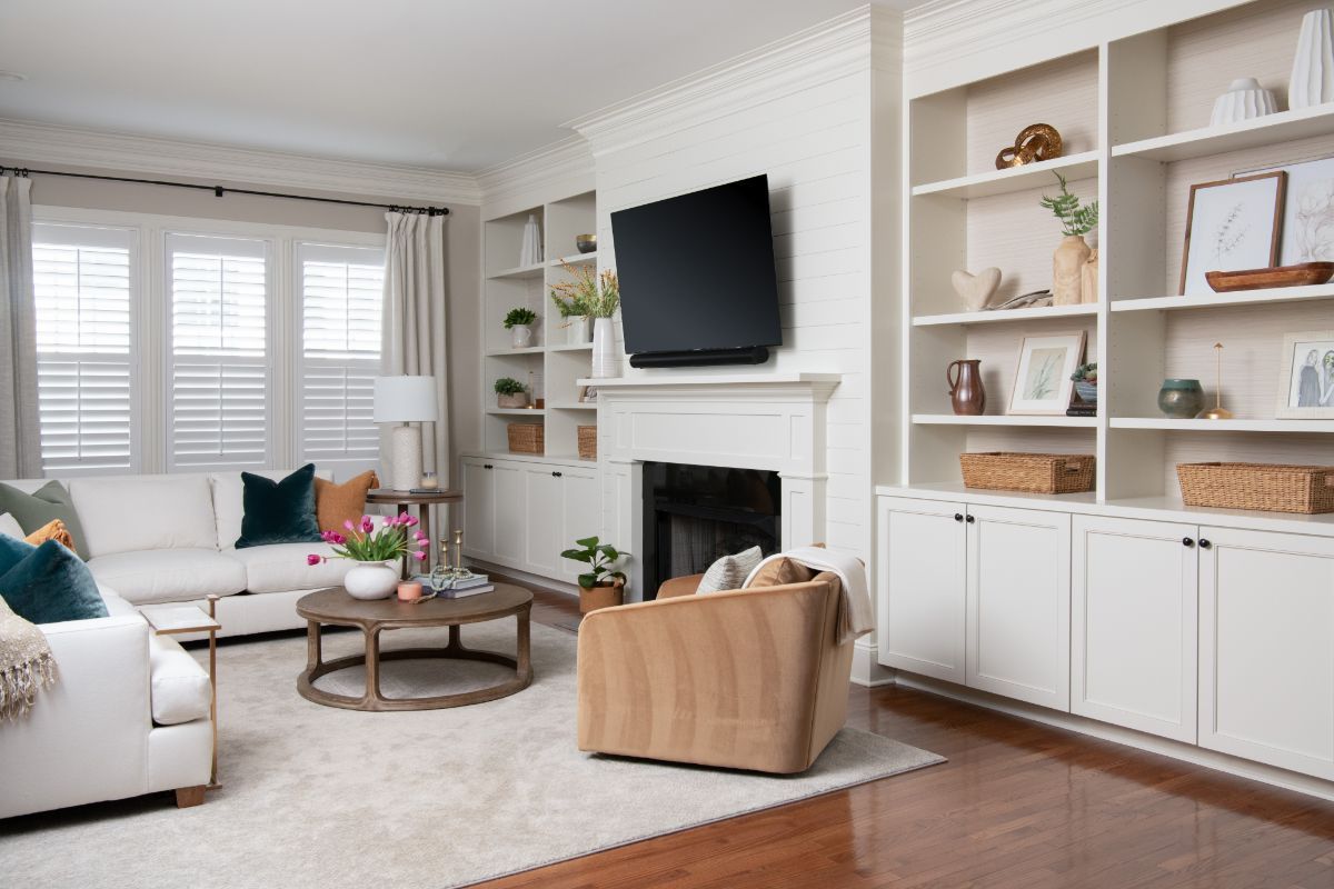 A living room with a fireplace , couch , chair and television - Charlotte, NC