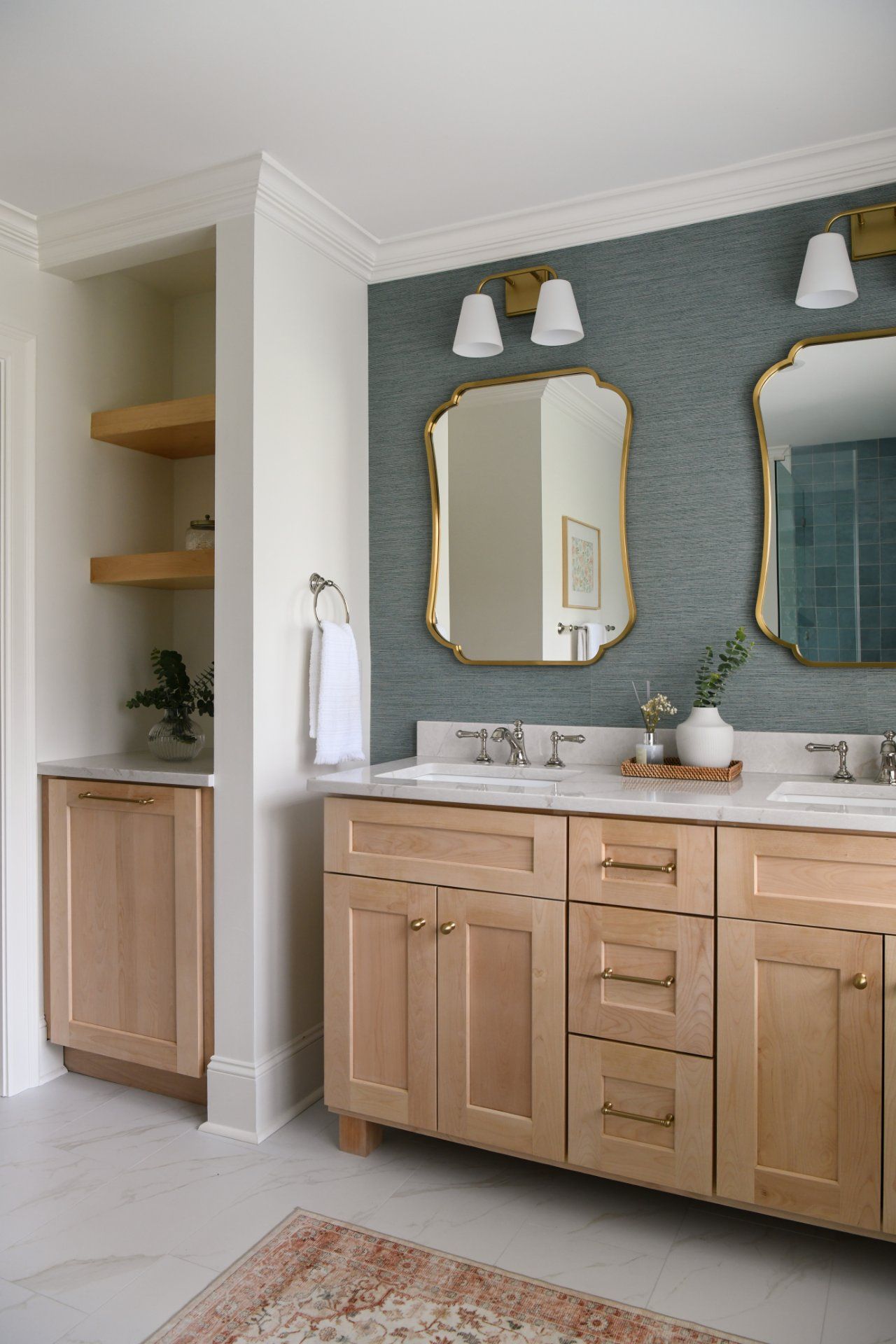 Modern bathroom vanity with wood cabinets, gold-framed mirrors, and gray walls | Weddington, NC | An Inspiring Home