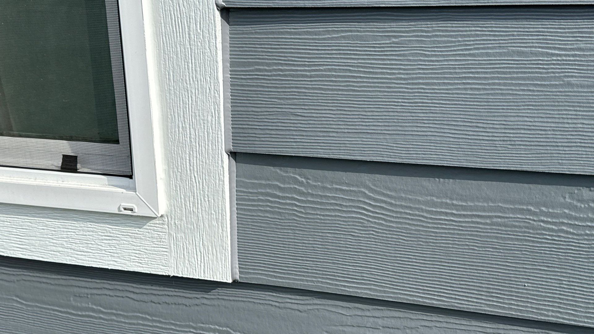 Close-up of weather-resistant vinyl siding on a house in Eugene, Oregon.