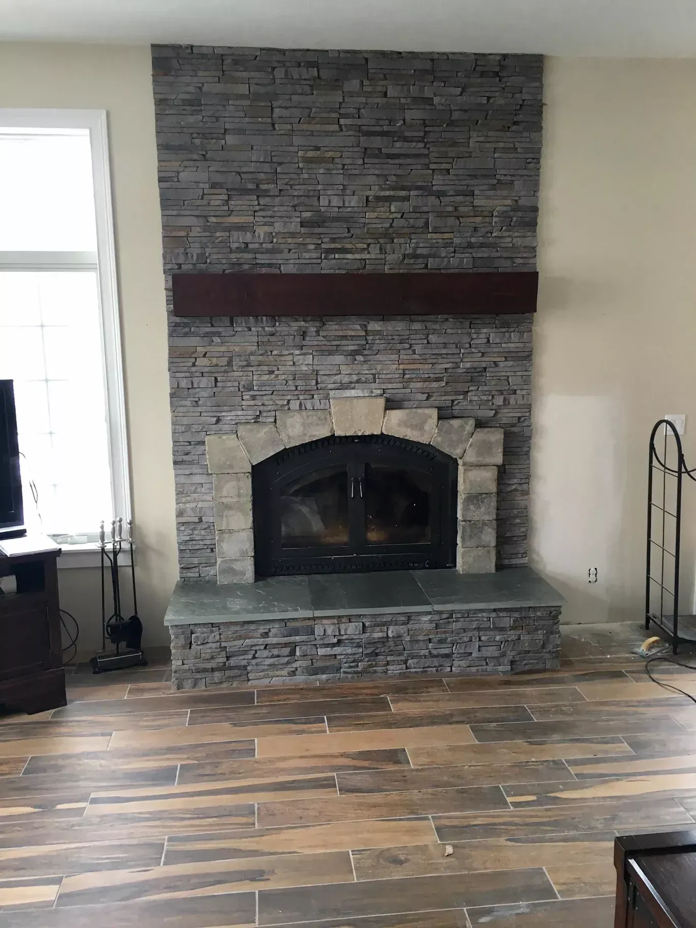 There is a fireplace in the middle of the room.