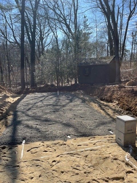 Man Holding The Metal Septic Cover — Andover, MA — Bateson Enterprises