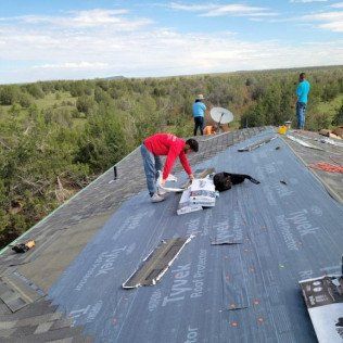 People repairing roof