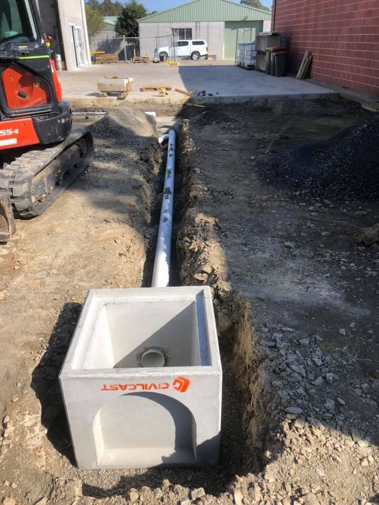 A Concrete Box is Sitting in the Dirt Next to a Pipe — BeCivil in Huskisson, NSW