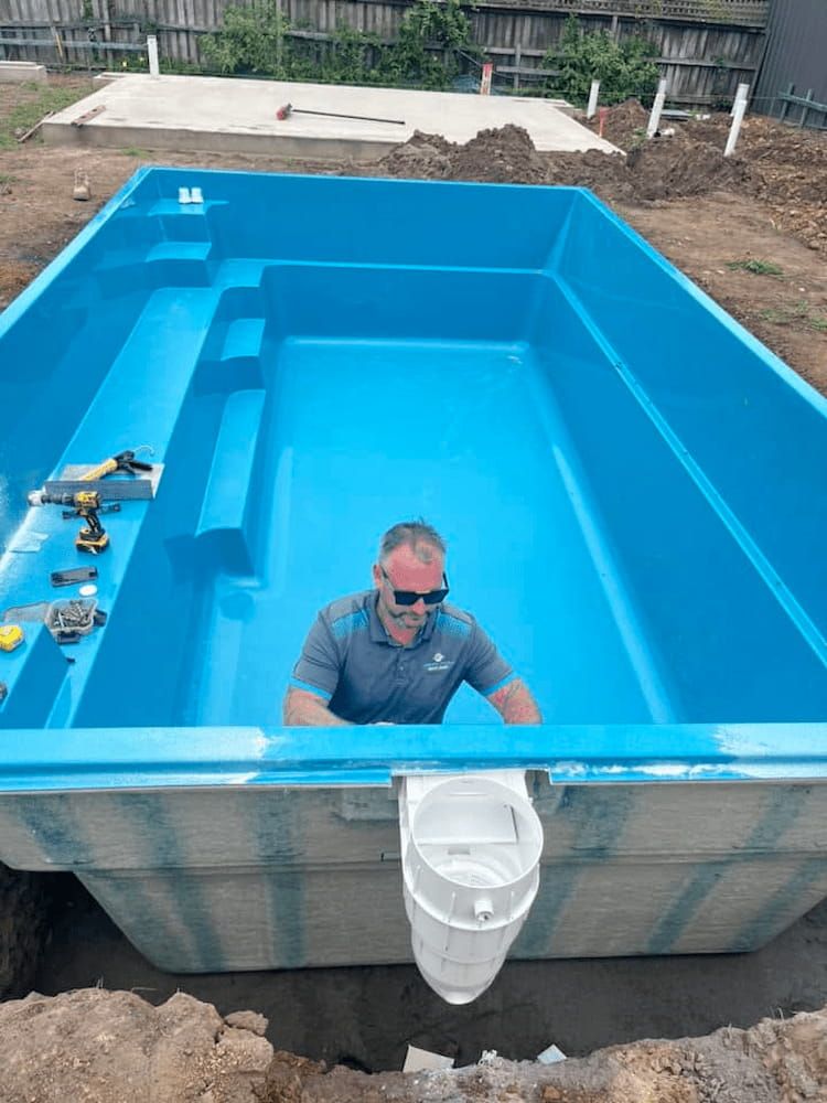 A Man is Standing in a Large Blue Swimming Pool — BeCivil in Tomerong, NSW