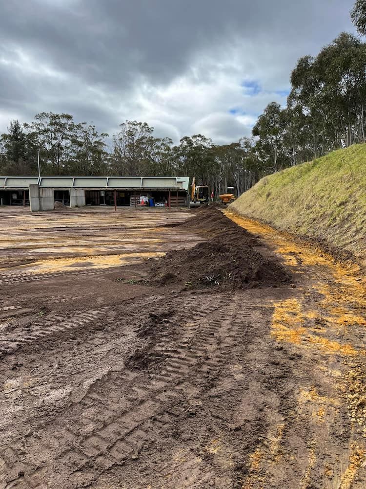 A Large Pile of Dirt is Sitting on the Side of a Dirt Road — BeCivil in Tomerong, NSW