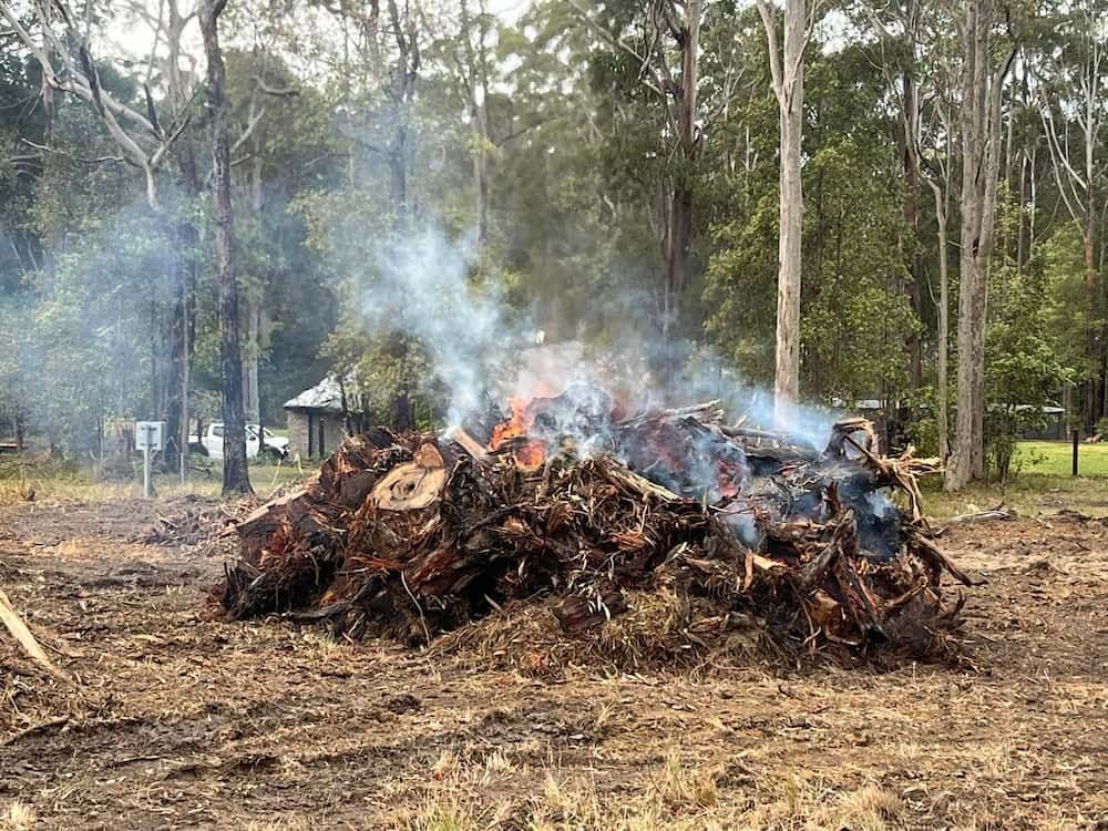A Pile of Wood Ablaze in the Center of a Grassy Field — BeCivil in Tomerong, NSW